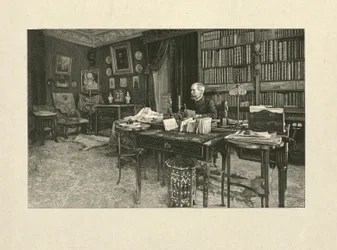 Gaston Tissandier, aeronauta francés, sentado en un escritorio en su estudio, 1880-1900